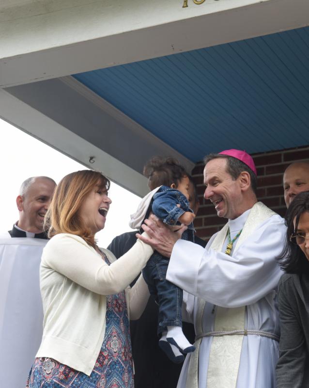 Bishop Burbidge meets baby Aizeck. (May 6, 2017)