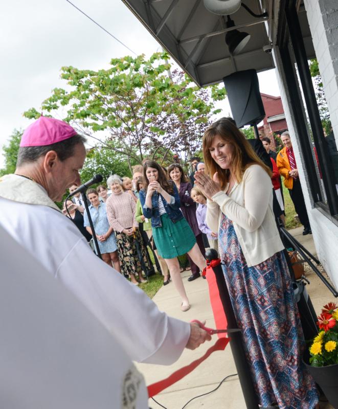 Bishop Burbidge cuts the ribbon with Kathleen Wilson. (May 6, 2017)