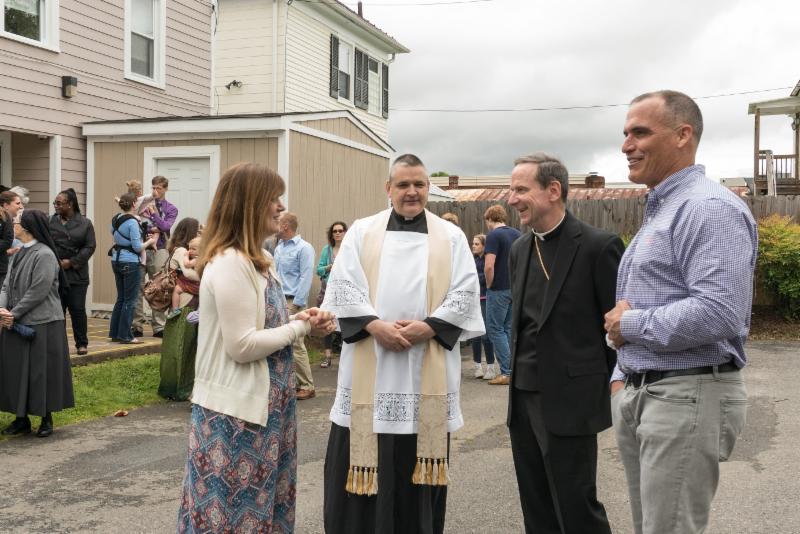 Mary’s Shelter Director Kathleen Wilson welcomes Bishop Burbidge, Father Mosimann, and Mark Doherty of MacDoc Property Management. (May 6, 2017)