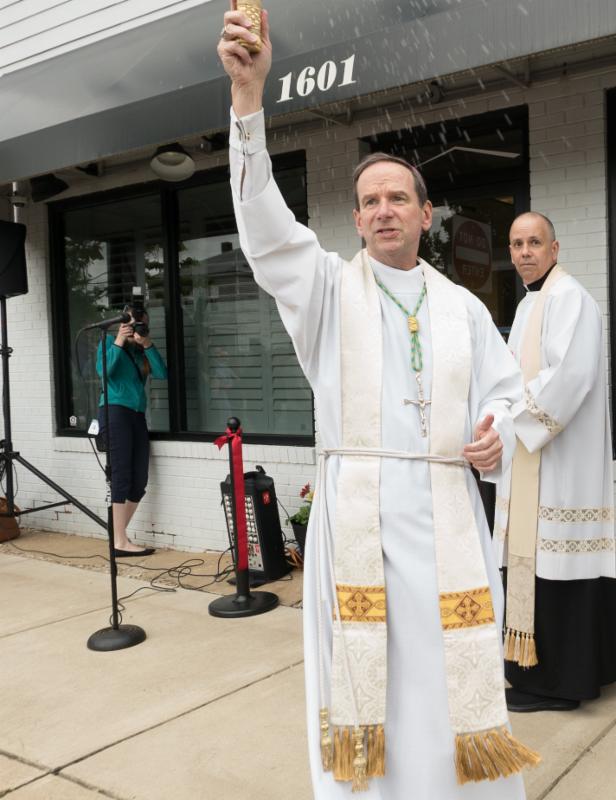 Bishop Burbidge blesses our guests before moving inside to bless our new office. (May 6, 2017)